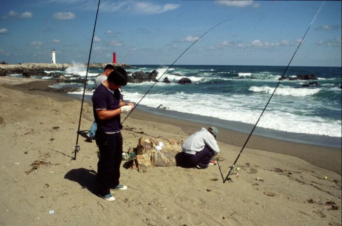 Angler am Meer